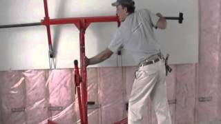 Installing drywall on upper walls with lift by Laurier Desormeaux [upl. by Atirb273]